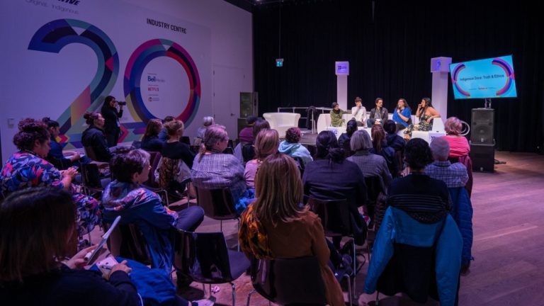 Speakers and audience at an Institute event